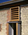 Bucknall House, cedar box frames in existing openings